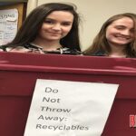 Alina Lawhon and Sara Smith work on the FBLA recycling project