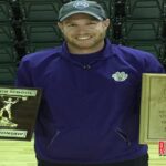 Coach Whit Overton, a 2004 Mansfield High School graduate, shows the state championship trophies his Booneville weightlifting team won recently at Alma.