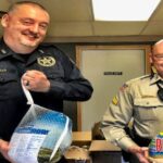 Hackett Police Chief Darrell Spells and Sebastian County Sheriff Deputy Mike Burcham deliver Thanksgiving meal boxes, kicking off Helping Hands campaign!