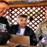 Hackett Police Chief Darrell Spells and Sebastian County Sheriff Deputy Mike Burcham deliver Thanksgiving meal boxes, kicking off Helping Hands campaign!
