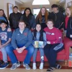 Mrs. Powel’s Art class 1 decorating the windows and doors at the Nursing Center with a variety of holiday art.